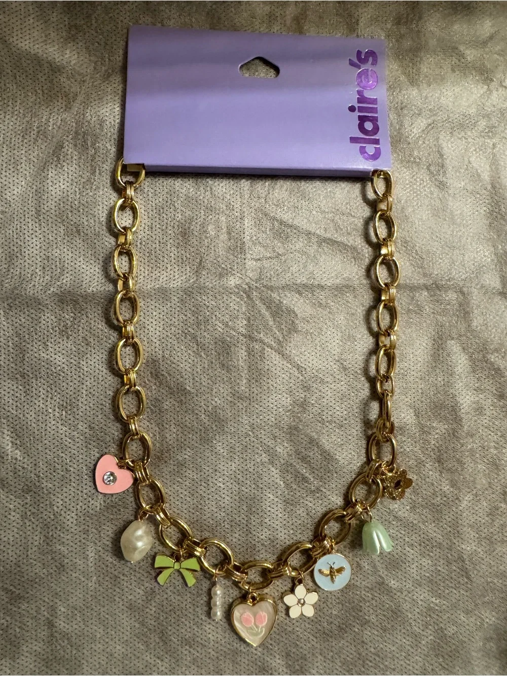 Claire's Gold Charm Necklace with Pastel Pink, Green, Blue and Cream Accents